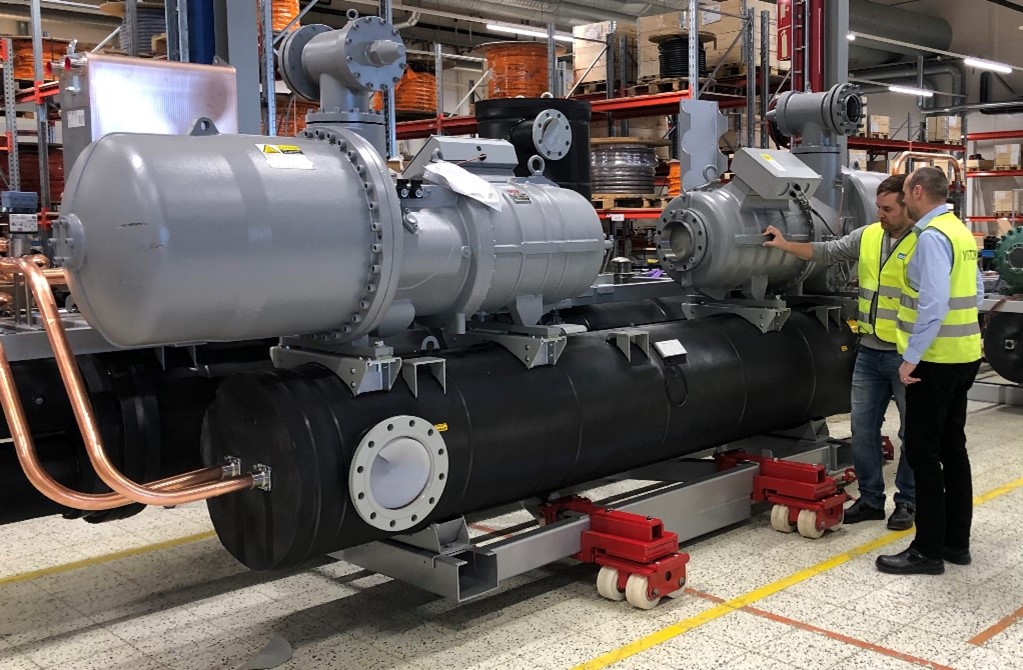 Ian Mellor Sales Director of Pure Thermal and Samuel Ostman Sales Manager of Oilon alongside an S1500 Oilon Industrial Heat Pump at the Oilon Kokkola manufacturing facility in Finland.